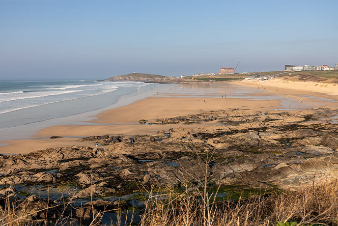 Looking out over the headland at the golden sands of Fistral beach, one of the best beaches in Newquay