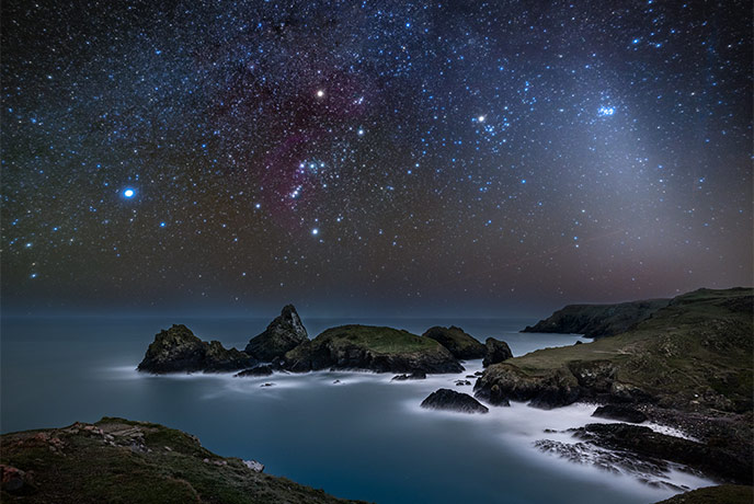 Kynance Cove at night with a sky full of stars
