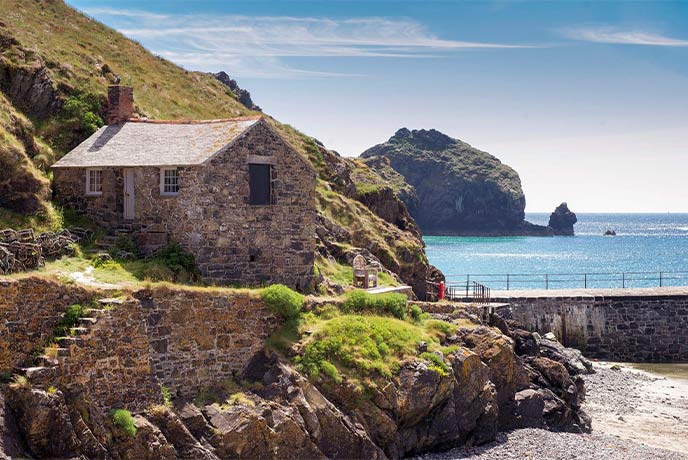 A pretty stone cottage on the harbour at Mullion Cove