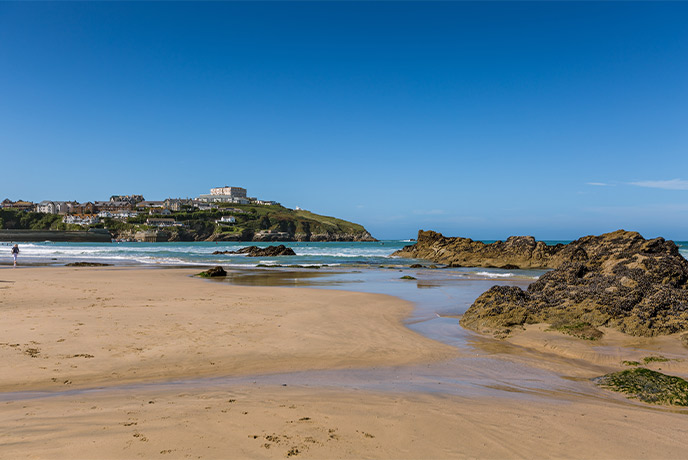 The golden sands and impressive rock stacks at Newquay Towan beach