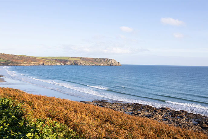 The golden sands and turquoise seas at Pendower beach on the Roseland