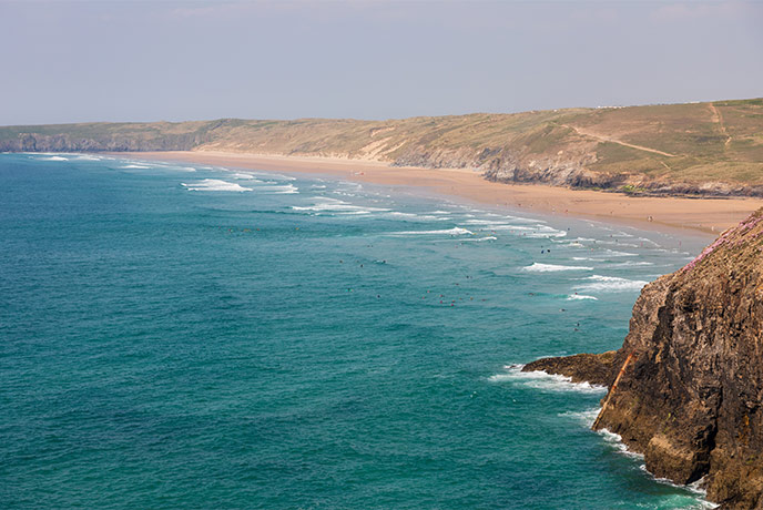 Looking out at Perranporth beach from the surrounding cliffs