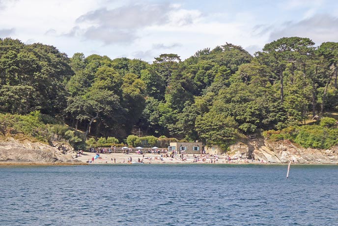 Looking across the water at the pretty Polgwidden Cove at the base of Trebah Gardens on the Helford River
