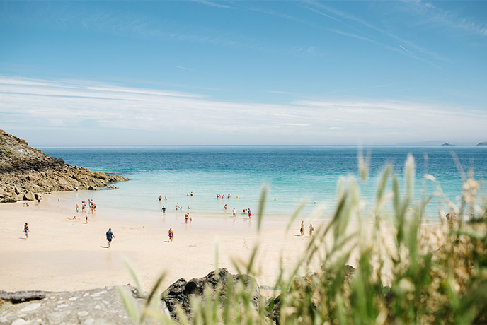 Golden sands and bright blue seas at Porthgwidden Beach in West Cornwall
