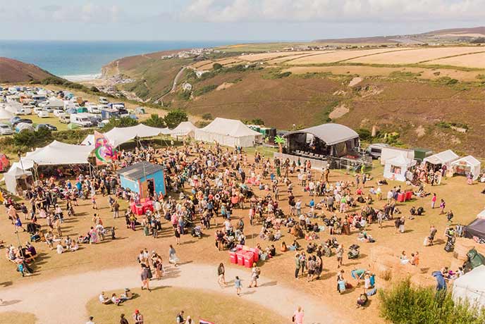 A bird's eye view of the Tropical Pressure Festival on cliffs in Cornwall
