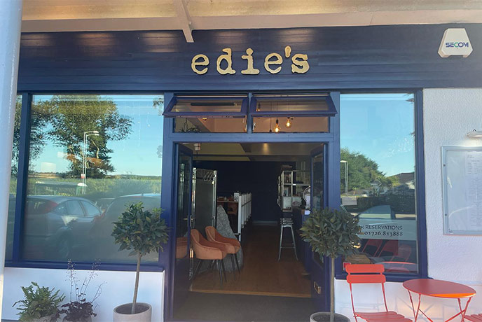 The dark blue exterior of Edie's in Cornwall