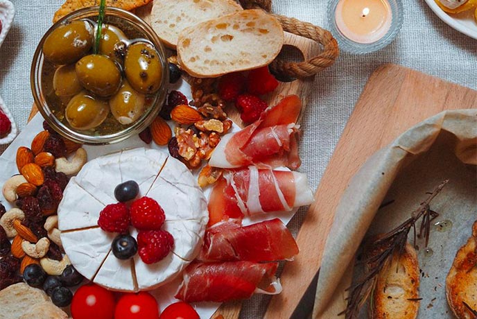 A platter full of deli meets, olives, and cheese at Trevaskis Farm