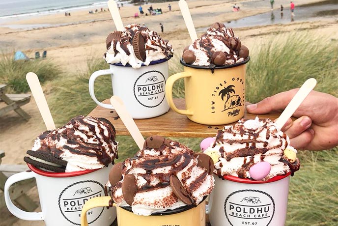Lots of hot chocolates topped with whipped cream at Poldhu Beach Café