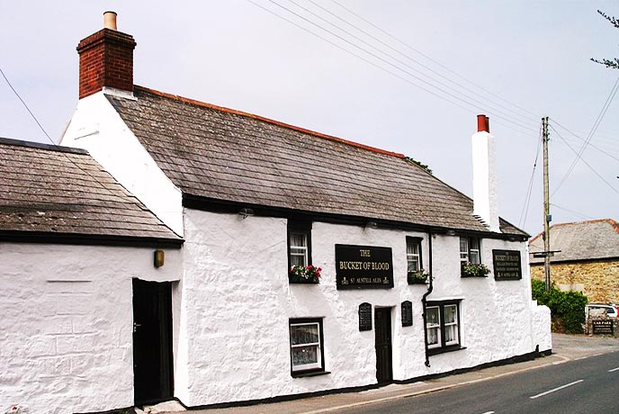 The traditional white-washed exterior of The Bucket of Blood inn in Cornwall