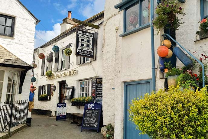 The traditional cottage exterior of The Three Pilchards Inn in Cornwall