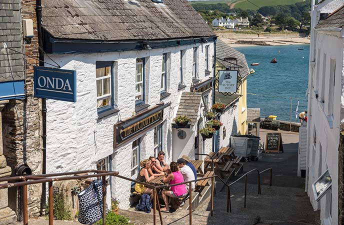 The quaint Victory Inn in St Mawes tucked into a narrow street overlooking the water