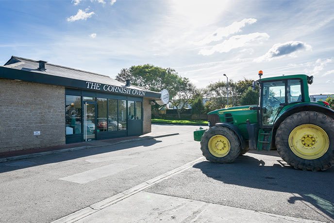 A tractor sitting outside one of the Cornish Oven bakeries