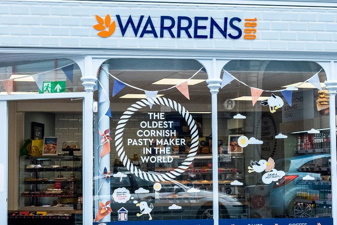 The colourful shop window of Warrens, one of the best pasty shops in Cornwall