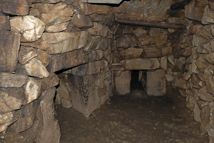 The ancient stone interior of Halliggye Fogue in Cornwall