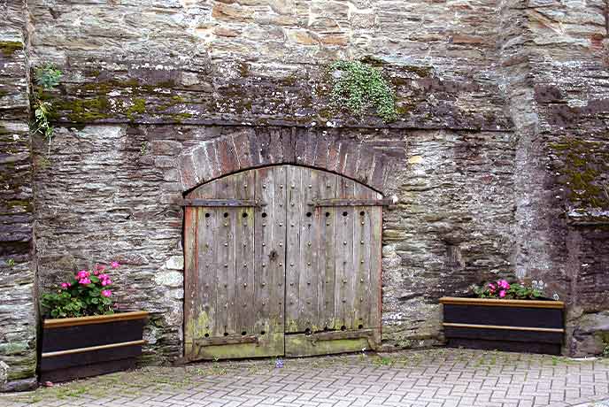 The ancient wooden door to The Old Duchy Palace in Lostwithiel