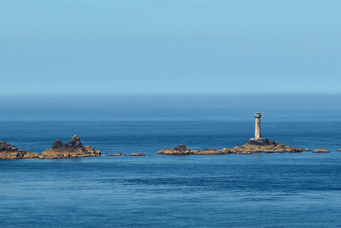 The strip of rocks and the Longships Lighthouse off the coast of Land's End in Cornwall