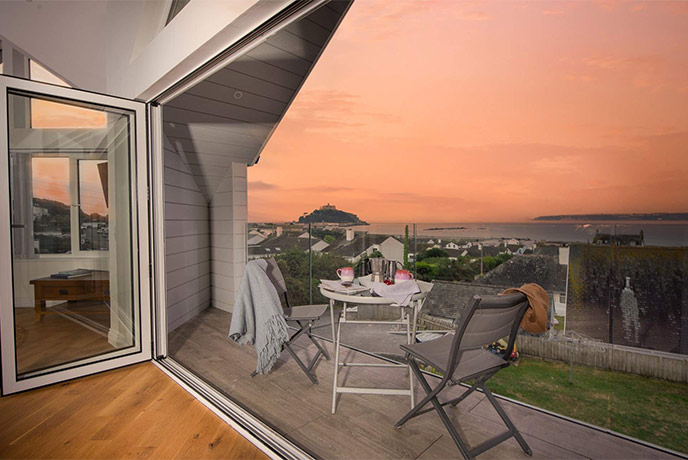 The terrace at Denham overlooking St Michael's Mount at sunset