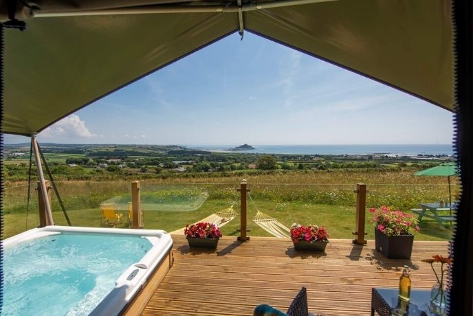 The hot tub and tent overlooking Mounts Bay at Mount View Sunrise Safari