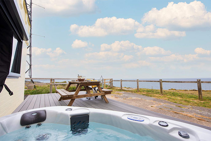A hot tub and sea views at Rame Head Lookout in Cornwall