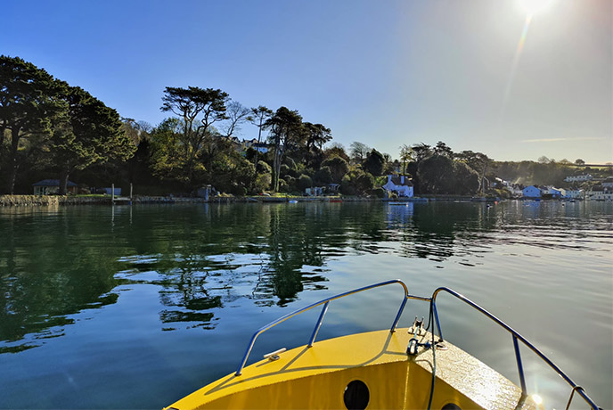 Looking out over the prow of one of the many boats from Falmouth Boat Hire at the stunning River Fal