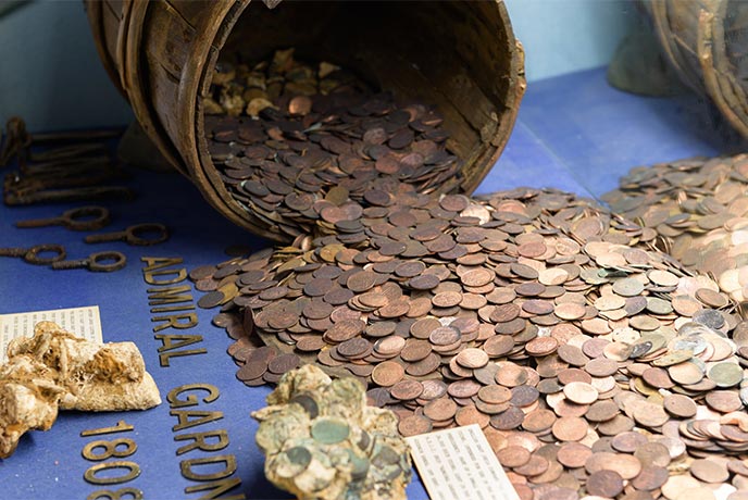 A barrel full of shipwrecked coins at the Shipwreck Treasure Museum