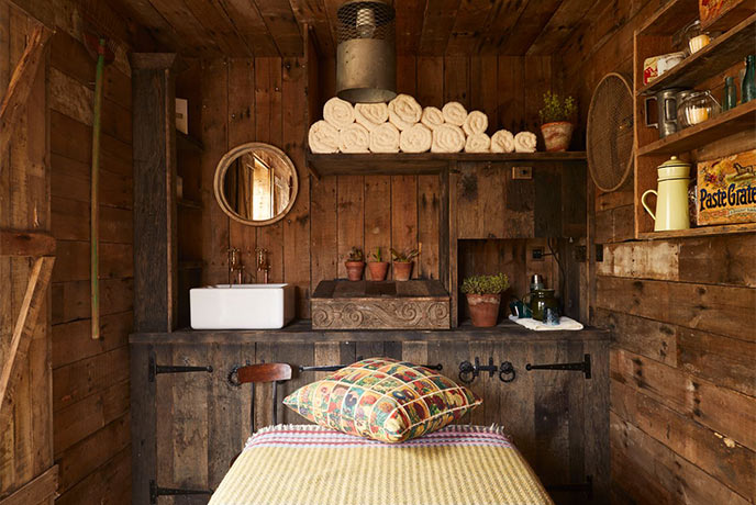 The cosy wooden treatment room at the Potting Shed at The Pig in Cornwall