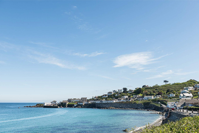 Looking across the bay at Coverack, with cottages perched on the harbour above the beach
