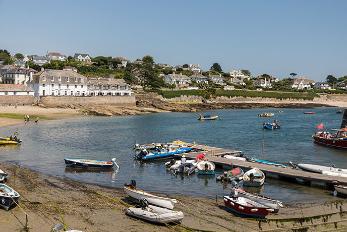 St Mawes harbour with boats moored and the village in the background