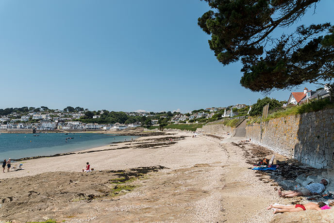 Looking down the golden sand of Summers beach in St Mawes