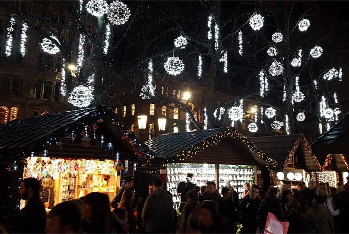 Pretty lanterns and lights illuminating the Cheltenham Christmas Market in the Cotswolds
