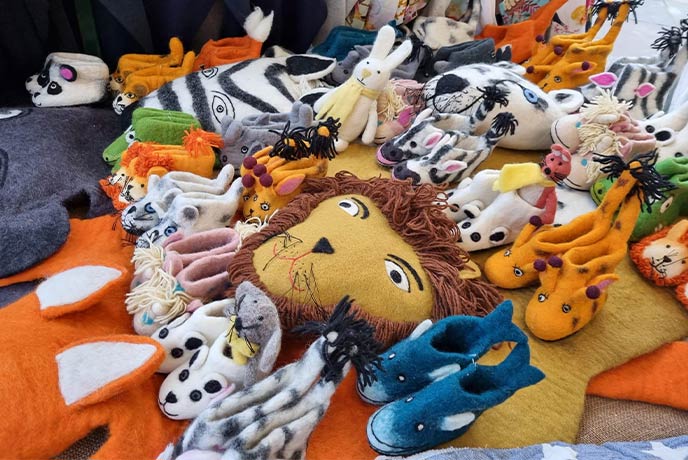 A selection of handmade animal shoes and toys at one of the Cirencester Markets
