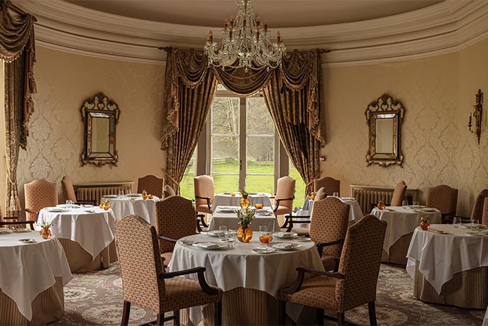 The beautiful, stately dining room at Restaurant Hywel Jones at Lucknam Park in the Cotswolds