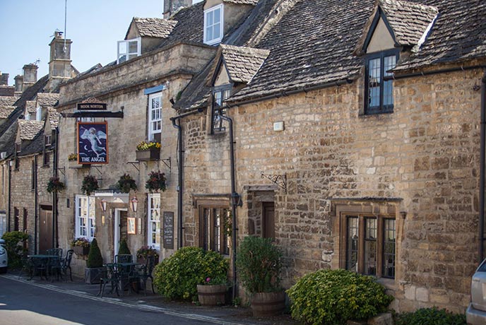 The pretty stone exterior of The Angel in the Cotswolds