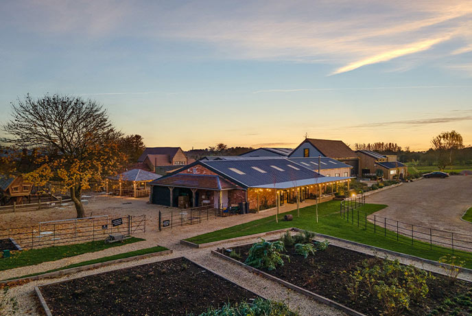 Looking out over the pretty farm shop and countryside surrounding The Farm in the Cotswolds