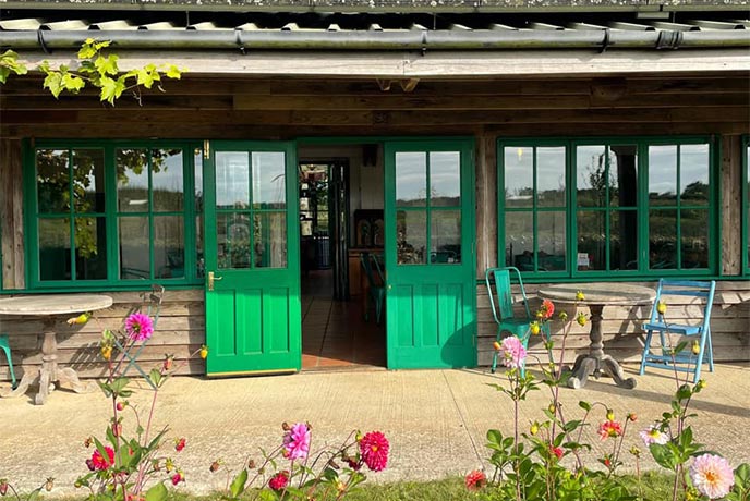 The veranda and lawn at The Organic Farm Shop in the Cotswolds 
