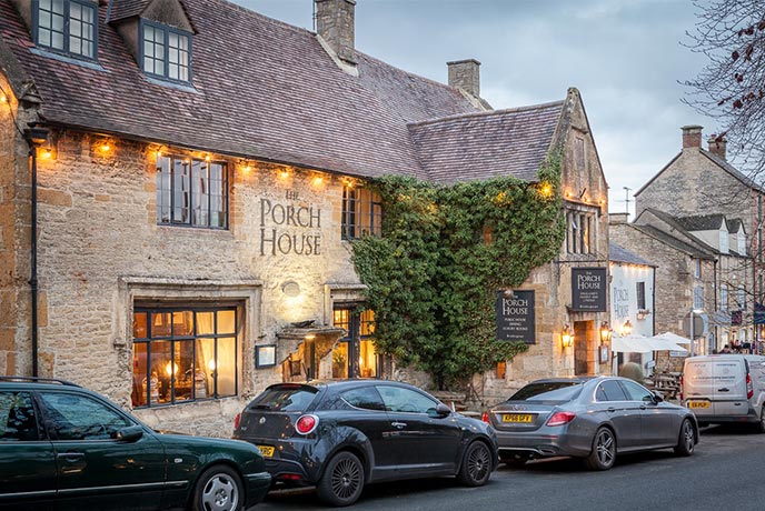 The honey-hued exterior of The Porch House where you can find a top Sunday lunch in the Cotswolds