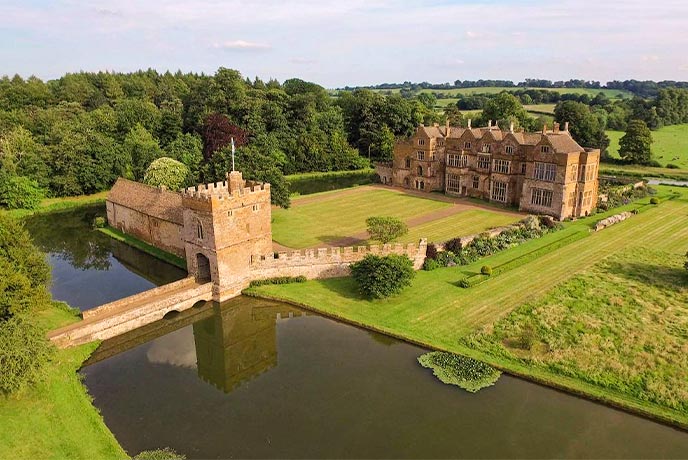 A bird's eye view of the gateway and house at Broughton Castle in the Cotswolds
