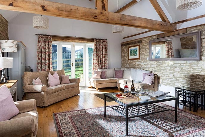 The quaint living area of Stonewell Cottage in the Cotswolds