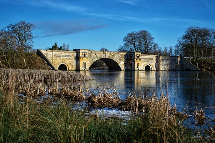 The picturesque bridge at the Queen Pool at Blenheim Palace on a winter's day
