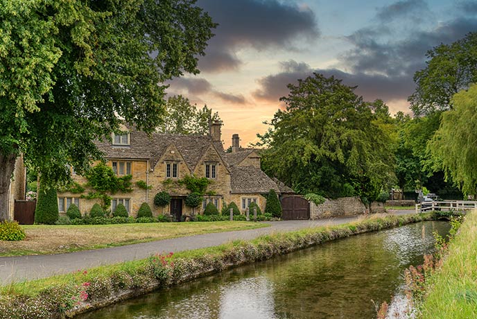 One of the many pretty cottages next to the River Eye in Lower Slaughter