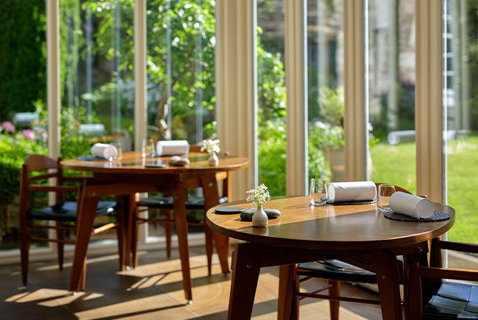 The sun-soaked dining room at Michelin star L'Enclume in Cumbria