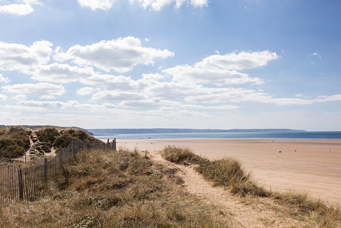 Sand dunes and reaching sands at Westward Ho! Beach on the South West Coast Path