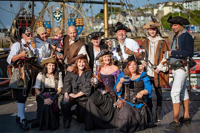 A group of people dressed up as pirates for the Brixham Pirate Festival