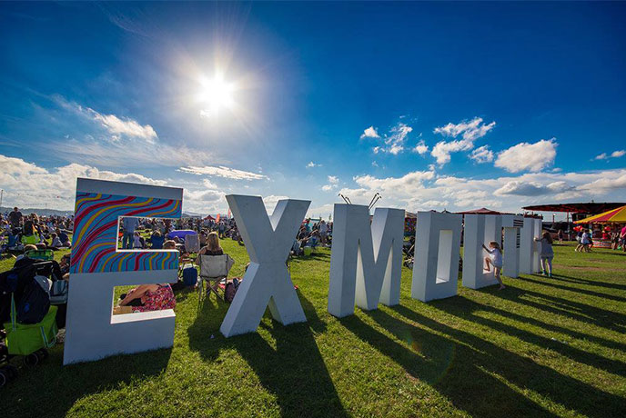 Giant white letters spelling out Exmouth at Exmouth Festival