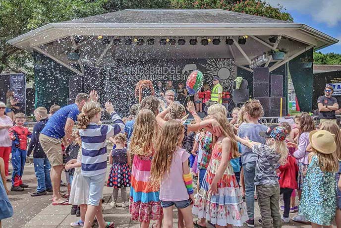 Children playing with bubbles at Kingsbridge Food and Music Festival