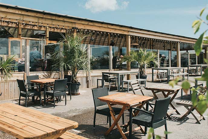 The sunny outside seating area at Greendale Farm Shop in Devon