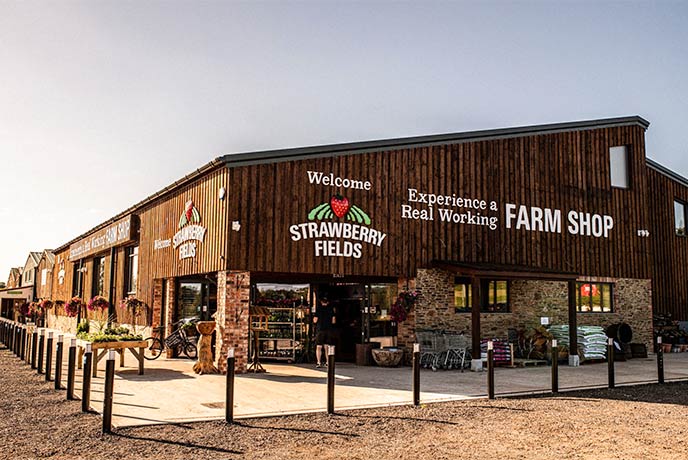 The wooden exterior of Strawberry Fields farm shop in Devon
