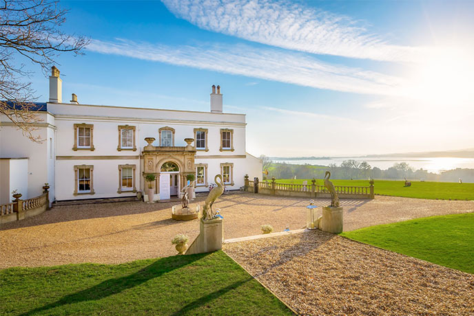 The beautiful Lympstone Manor with its impressive driveway and curated lawns