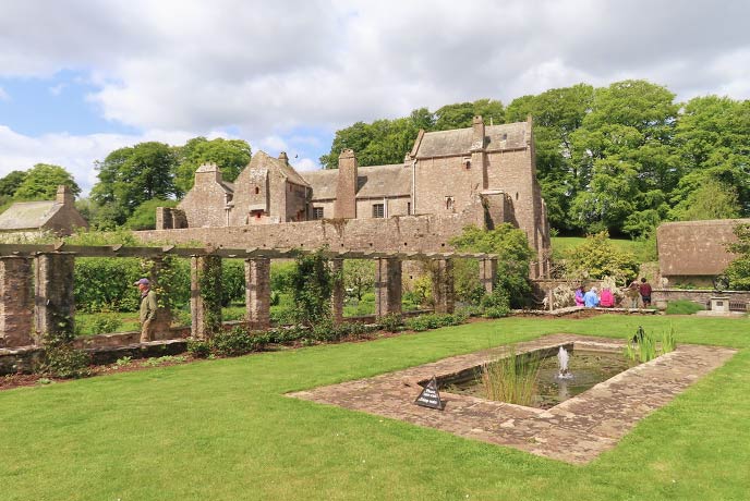 Looking across the lawns towards the historic Compton Castle in Devon