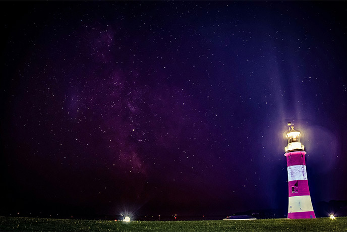 Smeaton's Tower Lighthouse at night time with stars overhead